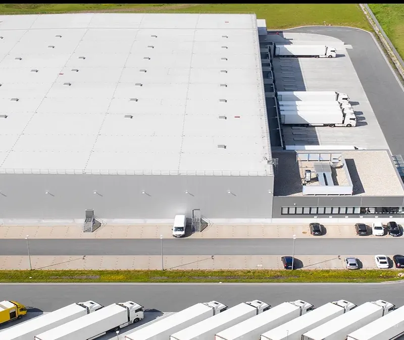 Aerial view of a modern commercial building with a flat roof — John Beal Roofing commercial roofing in Forsyth, MO