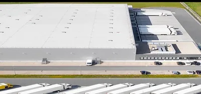 Aerial view of a large commercial building with a white roof — John Beal Roofing commercial roofing in Battlefield, MO