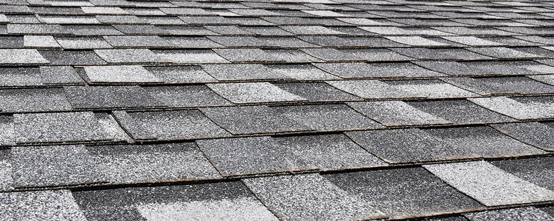 Close-up texture of dark grey architectural asphalt shingles — John Beal Roofing residential roofing in Strafford, MO