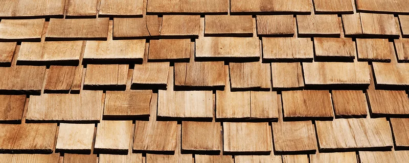 Brown wooden cedar shake roofing shingles installed on a roof — John Beal Roofing roofing in Benton, IL