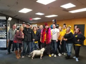 Company employees posing inside the warehouse — John Beal Roofing roofing in Columbia, MO