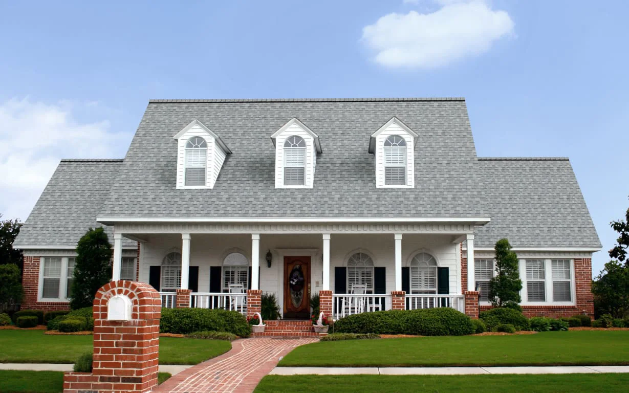 Antique Silver Duration STORM shingles on a house