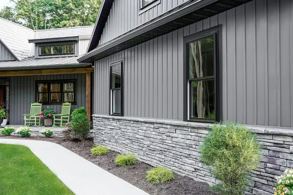Cedar Peaks and HeartTech siding in Nightfall — home exterior