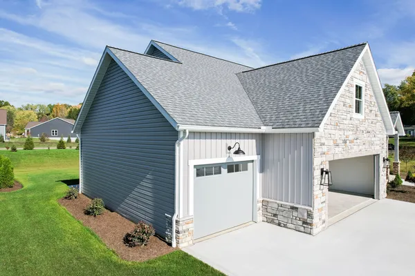 Cedar Peaks and HeartTech siding in Pewter — home exterior