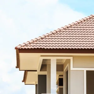 Residential roof edge with decorative corbels and stucco — John Beal Roofing residential roofing in Centralia, MO