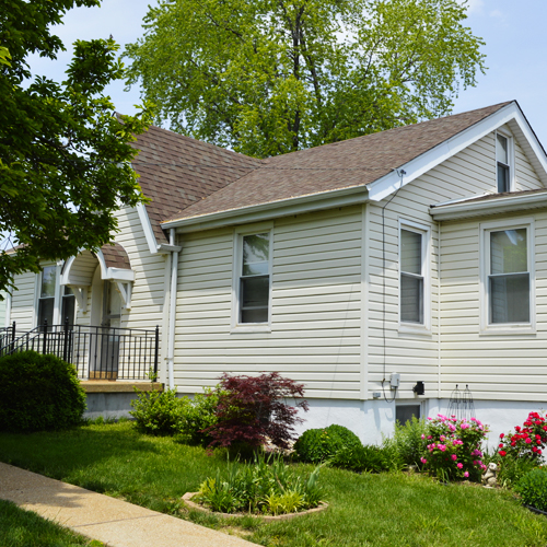 Small house with asphalt shingle roof