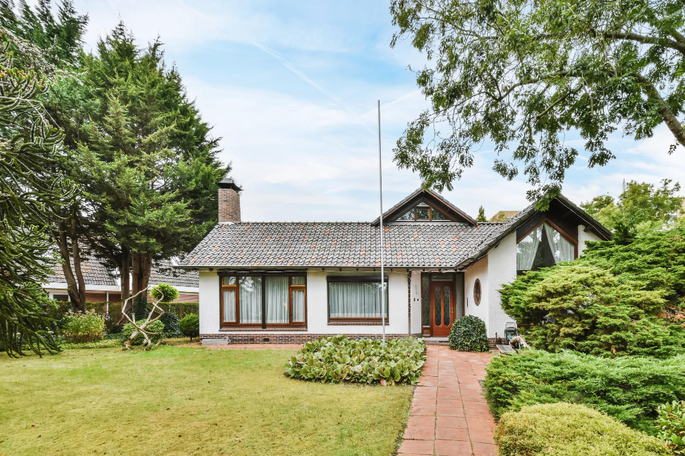 White one story home with slate roof